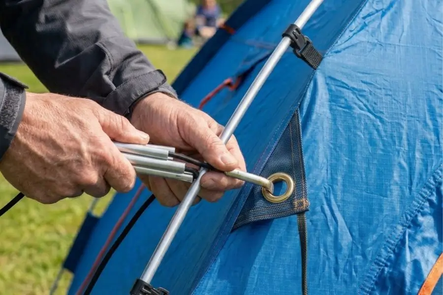 inserting poles + clipping tent body